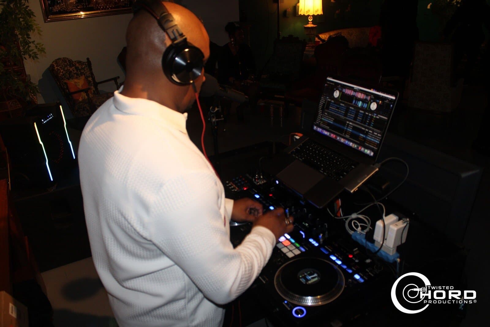 DJ in headphones working the decks
