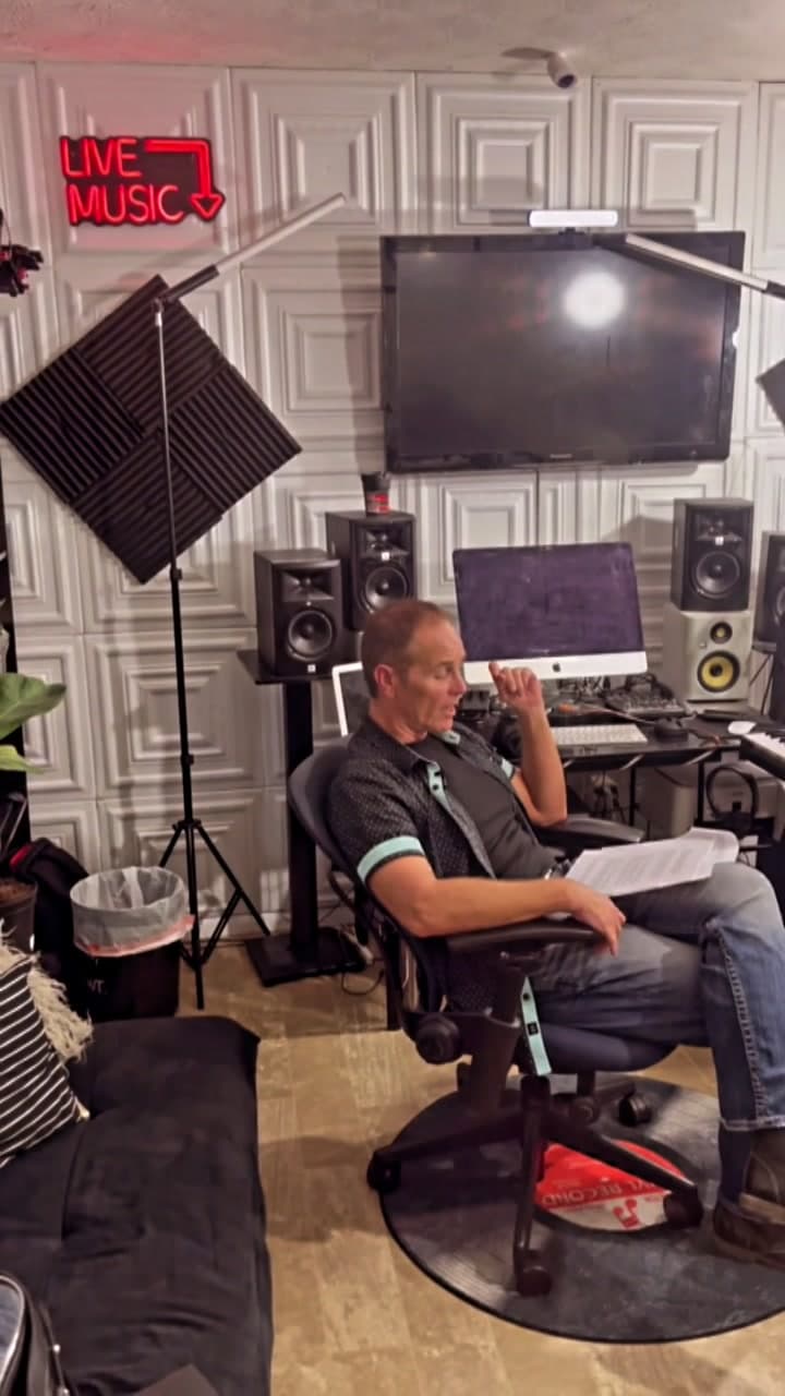 Scott in his chair on the And The Nation Shall Know set, surrounded by studio gear