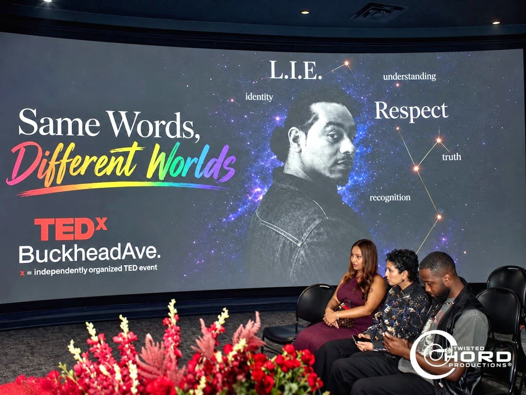 Guests seated before the Same Words, Different Worlds screen at TEDx Buckhead Ave